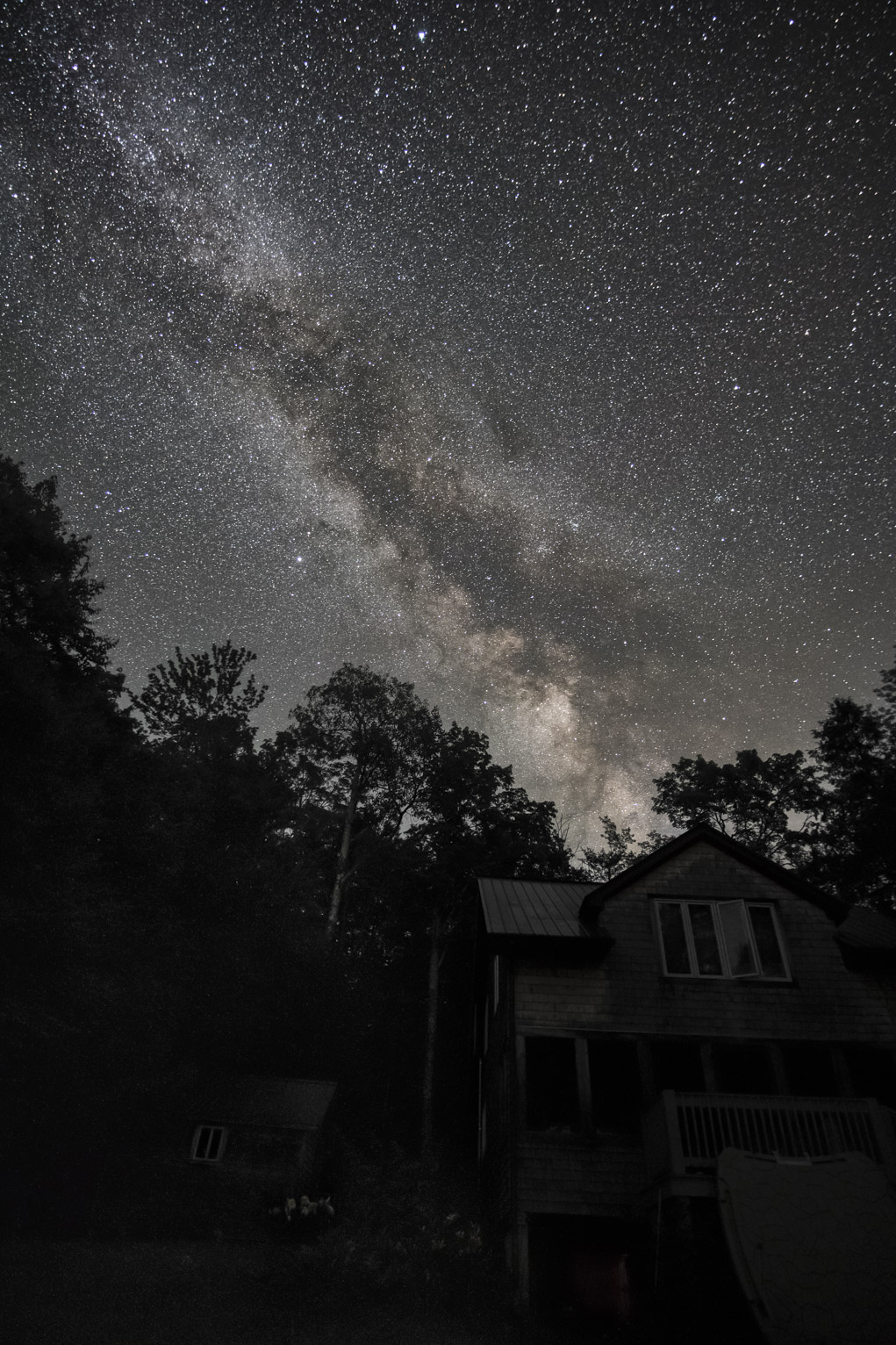 The Milky Way tall above a cabin